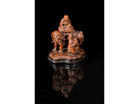 Top lot of Duke's recent sale in Dorset was this important Chinese hardwood carving of a bald-headed deity seated on a lion. It sold for 10 times its estimate at £320,000 ($511,775).
