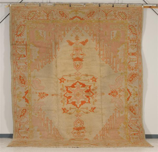 Ushak carpet, West Anatolia, late 19th century, 14 ft. x 10 ft. 6 in., estimate: $8,000-$12,000. Image courtesy of Skinner Inc.