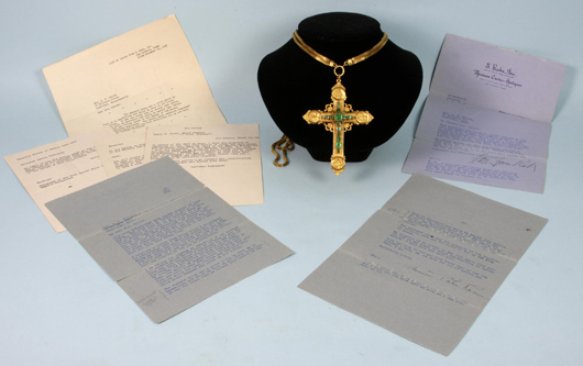 Mid-19th-century Emperor Maximilian cross given by Pope Pius IX, 18k gold with 12 large emeralds representing the apostles. Accompanied by letters verifying its authenticity. Est. $25,000-$30,000. Image courtesy of Kaminski Auctions.