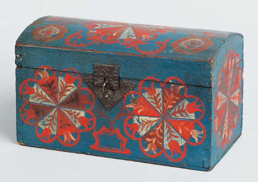 Lancaster County, Pa., compass artist dome lid box, circa 1800, pinwheel design with unusual variation of tulip petals on a vibrant blue background, 5 3/4 inches high x 9 1/2 inches wide. Est. $20,000-$40,000. Image courtesy of Pook & Pook Inc.