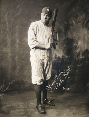 Full-length portrait of baseball legend Babe Ruth with facsimile signature "Yours truly 'Babe' Ruth," taken on July 23, 1920. Part of a series of eight photographs of Ruth in the United States Library of Congress's Prints and Photographs division