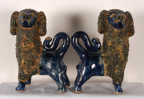 Beautifully sculpted and glazed matching dogs by Billy Ray Hussey (North Carolina, b. 1955). Image courtesy of Slotin Folk Art Auction.