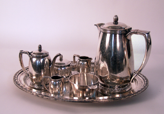 Silver-plated coffee and tea serving set by International Silver Co. Bottoms of the pieces are stamped ‘United States Lines.’ This set comes from the ocean liner United States. Estimate: $1,200-$1,500. Image courtesy Boston Harbor Auctions.