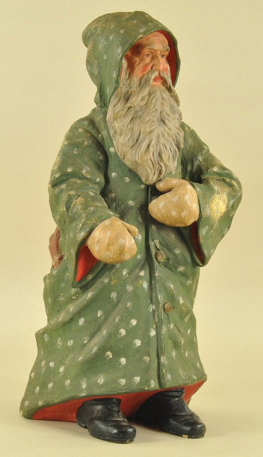From a selection of more than 500 holiday antiques in the Sunday session, a rare chalkware Father Christmas figure, 26 inches tall (store display size), exhibits exceptional detailing to its face. Estimate $6,000-$7,500. Bertoia Auctions image.