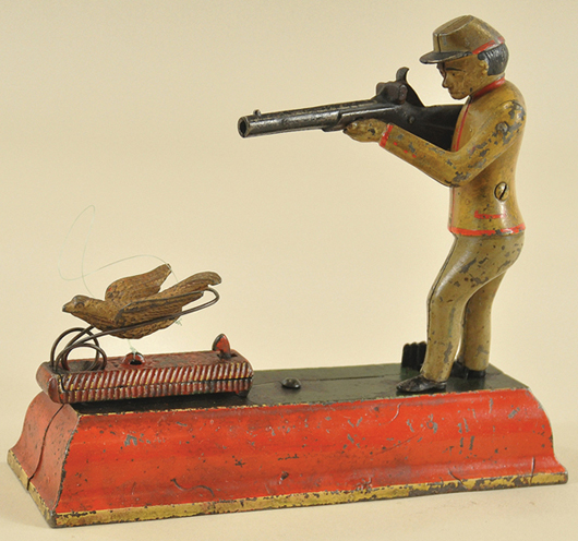 A J. & E. Stevens Sportsman or “Fowler” cast-iron mechanical bank, circa 1892, is estimated at $8,000-$10,000. Bertoia Auctions image.