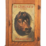 The lithographed tin picture of a horse staring from this medicine cabinet added to its value. The store cabinet for Dr. Lesure's Remedies sold for $4,095.