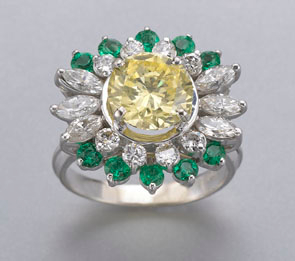Fancy natural yellow diamond ring with central round brilliant cut natural fancy yellow diamond flanked by 10 round brilliant cut Columbian emeralds. Estimate: $9,000-15,000. Image courtesy of Dallas Auction Gallery.