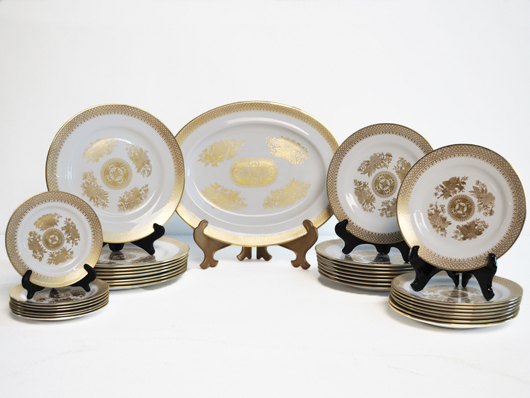 Bone china dinner service, Spode, Golden Clipper pattern. White with gold borders and decoration. Seventy-five pieces consisting of service for eight and several serving pieces. Estimate: $1,000-$1,500. Image courtesy of Morton Kuehnert Auctioneers & Appraisers.