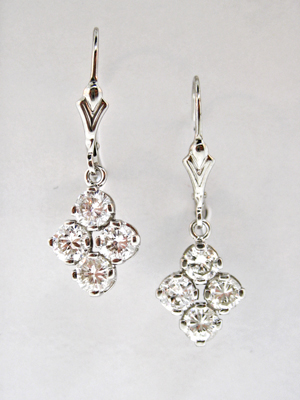 Pair of 14K white gold diamond dangle earrings set with eight circular cut diamonds totaling 2.00 carats total weight, I-Color Grade, SI2-Clarity Grade. Ear-wires are pierced French back-style. Estimate: $1,000-$1,700. Image courtesy of Morton Kuehnert Auctioneers & Appraisers.