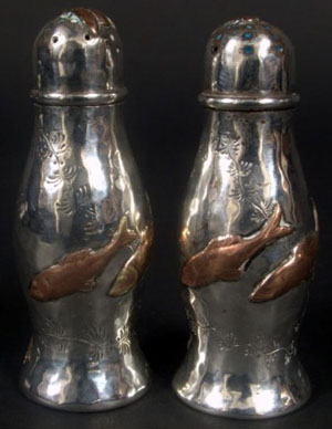 Copper colored fish are applied to these sterling silver shakers. Image courtesy of Capo Auction.