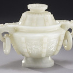 Carved with dragon handles with two free rings, this 5 1/2-inch jade lidded censer sold for $80,000. Image courtesy of Dallas Auction Gallery.