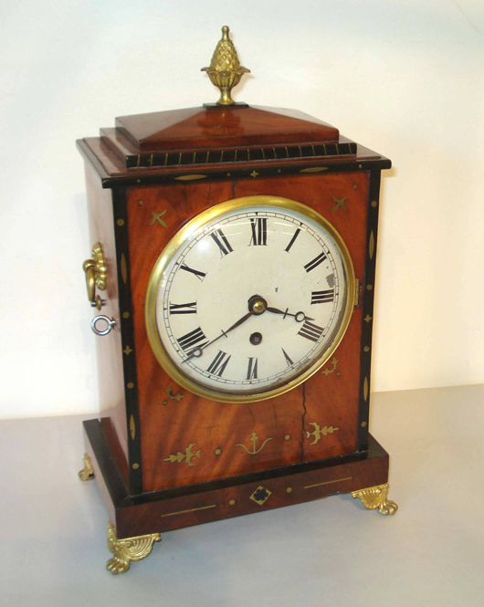 Fine Regency bracket clock, or chamber clock, in a solid mahogany case with Egyptian-style feet. Image courtesy of Gordon S. Converse & Co.