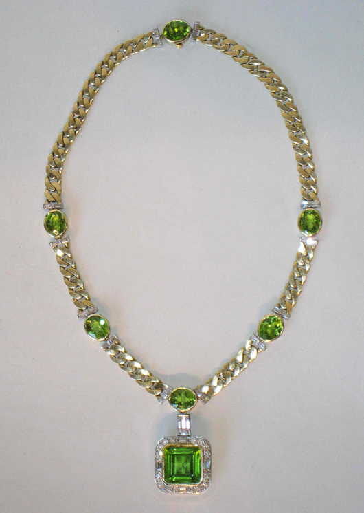 Gorgeous 14-inch necklace with a 14mm central square peridot, with surrounding cut diamonds. Image courtesy of Gordon S. Converse & Co.