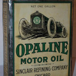 Sinclair Opaline Motor Oil 1-gallon flat metal can with race car graphic, rated 8.5, $3,300. Image courtesy of Matthews Auctions LLC.