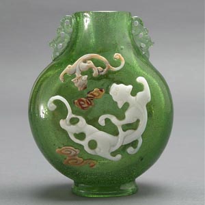 Transparent green moon flask glass vase with overlay decoration. Estimate:  $4,000-$6,000. Image courtesy of Michaan’s Auctions.