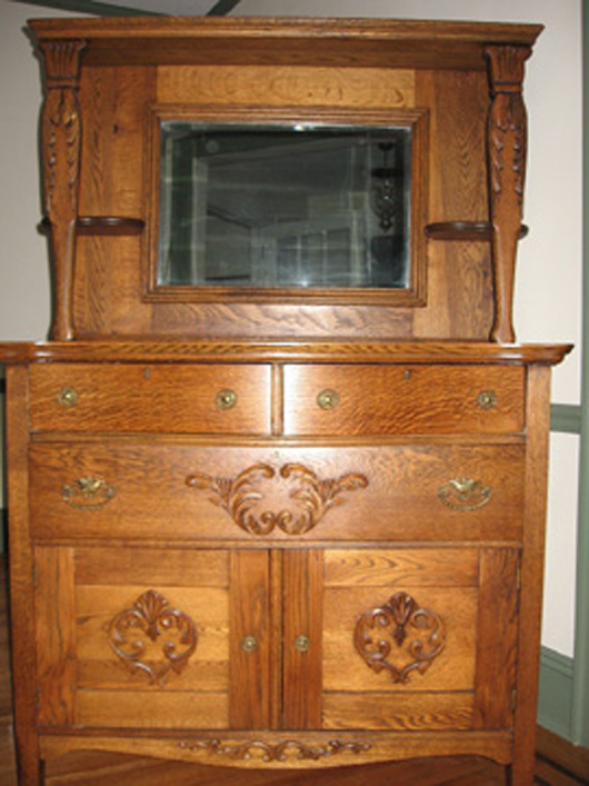 This turn of the 20th-century sideboard offers a comparison between quartersawn oak in the drawer fronts and flat cut oak in the rest of the piece.