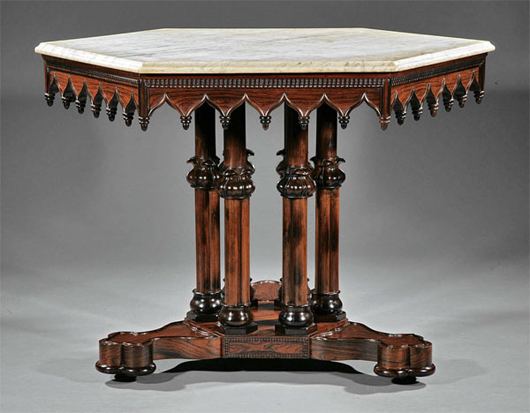 This circa 1845 American Gothic carved rosewood center table after a design by Alexander Jackson Davis (1803-1892), New York, realized $44,812 against a presale estimate of $25,000-$35,000. Image courtesy of Neal Auction Co.
