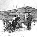 A 19th-century photo of a Minnesota family in front of their log cabin. Photo courtesy of the Minnesota Historical Society.