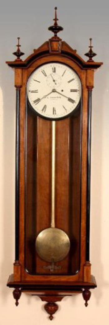 E. Howard #71 regulator wall clock, circa 1880s, 70 inches tall, black walnut case, $25,875. Image courtesy of Fontaine’s Auction Gallery.