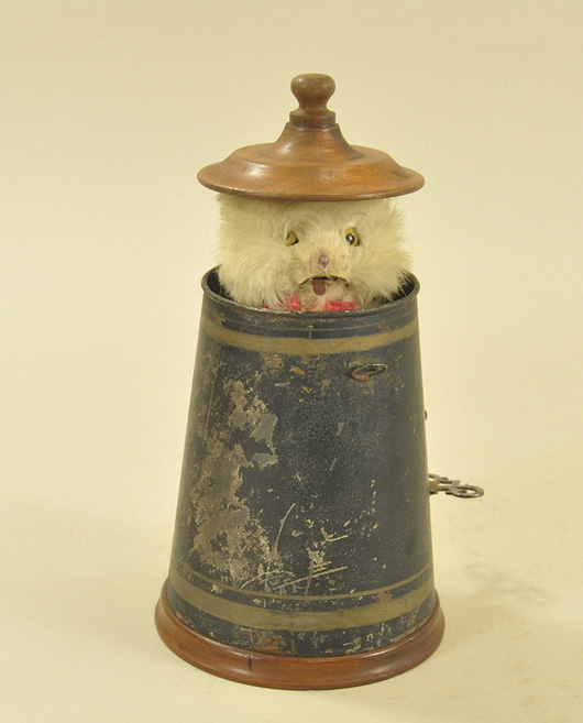 Mechanical “Peek-a-Boo” Cat in pot, pictured in 1893 Ives catalog, $8,050. Bertoia Auctions image.