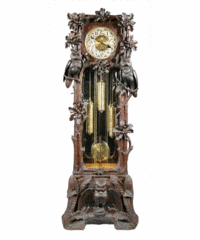 Owls, oak leaves, acorns and ferns are carved on the sides and base of this tall case clock. The 7-1/2-foot-tall clock sold for $14,000. The works are marked ‘Hawina,’ a German trademark.