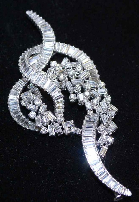 Diamond platinum brooch, retro Knot and Cascade design, 11.01 total carat weight. Estimate: $20,000-$30,000. Image courtesy of Four Seasons Auction Gallery.