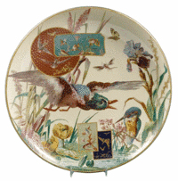 Fish, birds, a crayfish, moth, dragonfly, kingfisher, duck, water lilies and iris are all part of the foliage and scenery on this aesthetic plate. The 17 1/2-inch charger was made in France by Barluet & Cie and recently sold at a Skinner auction in Boston for $1,007.