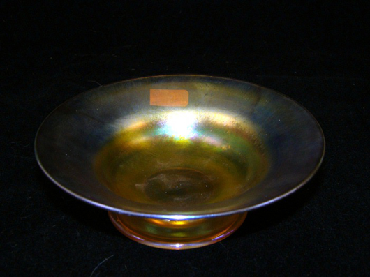 Tiffany Favrile bowl, signed L. C. Tiffany Co., 2 inches by 6 inches. Estimate: $350-$450. Image courtesy of T A C Auctions.