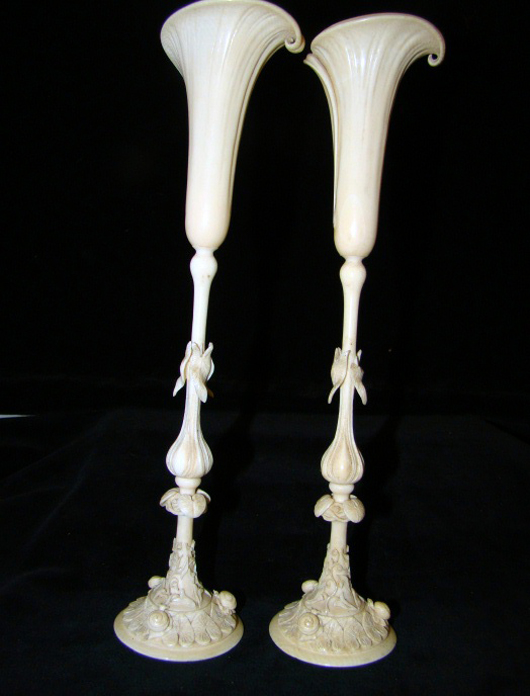 Pair of ivory tulip form vases, 10 inches. Estimate $300-$500. Image courtesy of T A C Auctions.