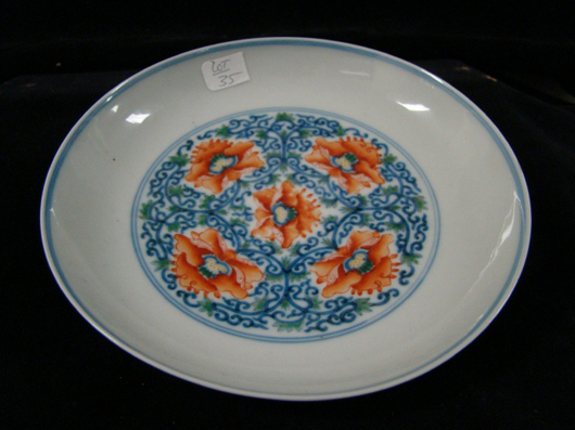 Small Chinese Dish with Yongzheng mark. Estimate: $300-$500. Image courtesy of T A C Auctions.