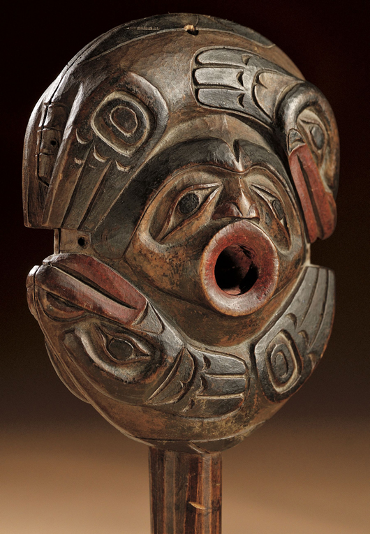Rare Northwest Coast shaman's rattle, circa 1840-60, probably Tlingit, carved in two pieces with central mask-like face on each side. Estimate: $20,000-$30,000. Image courtesy of Skinner Inc.