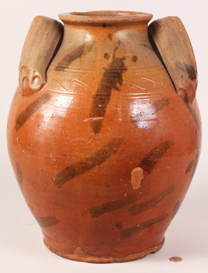 An important redware jar attributed to the Cain Pottery of Sullivan County, Tenn. Estimate: $7,000-9,000. Image courtesy of Case Antiques.