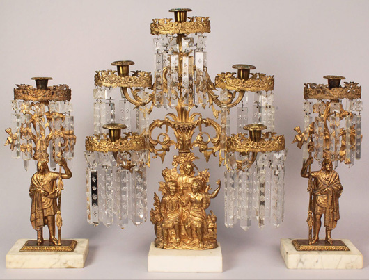‘Daniel Boone’ gilt bronze girandole garniture set by Cornelius & Co., depicting figures from James Fenimore Cooper's ‘Leather Stocking Tales,’ and Osage Indian figures modeled after a Catlin portrait print. Estimate: $600-$1,000. Image courtesy of Case Antiques.