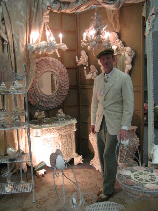 Brett Gregory and some of his shell creations. Image courtesy of the West Palm Beach Antiques Festival.