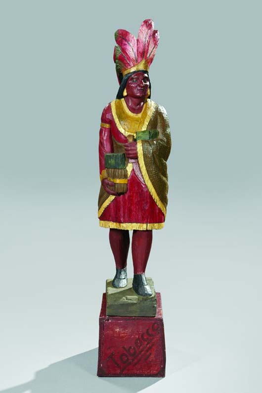 Rare carved and polychromed American Indian cigar store figure, third quarter 19th century, attributed to Samuel A. Robb, New York, front stenciled ‘Tobacco,’ 70 inches high. Estimate:  $30,000-$50,000. Image courtesy of New Orleans Auction, St. Charles Gallery.