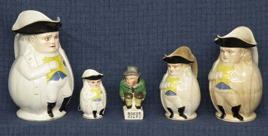 Four earthenware Napoleon Toby jugs, circa 1900, marked ‘pat apl for Alfred H. Evans, Phila, PA,’ largest 9 3/4 inches high, smallest: 4 1/4 inches high. Estimate: $250-$500. Image courtesy of T. Glenn Horst & Son Inc.