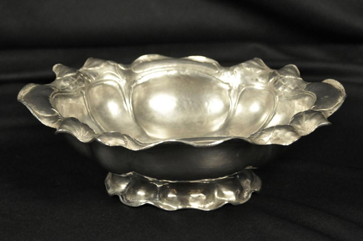Gorham Martele hand-hammered bowl shaped with leaf and floral edge, marked 9584, initialed 'L.I.S.', 24.6 troy ounces, length: 11 inches, height: 3 inches. Estimate: $4,000-$6,000. Image courtesy of John McInnis Auctioneers.