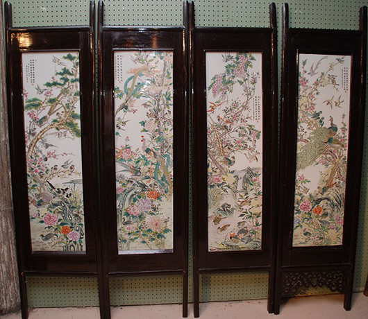 Famille Rose porcelain plaques highlight this Chinese four-section screen, which extends to nearly six feet wide. With one of the panels damaged, the screen has a $2,000-$4,000 estimate. Image courtesy of Bill Hood & Sons.