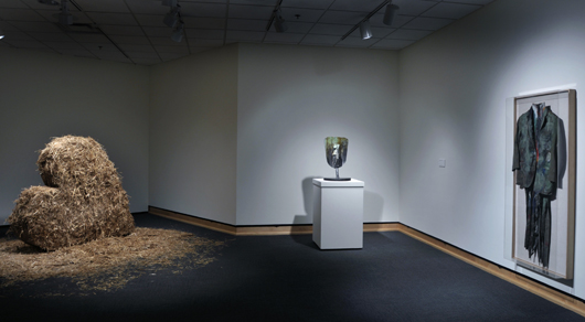 Shown (left to right): ‘Nancy and I at Ithaca,’ 1966–1969, sheet metal and straw, 62 x 72 x 14 inches; ‘A Lady and a Shovel,’ 1983, cast bronze, 26 x 26 x 16 inches; and ‘Green Suit,’ 1959, oil on cloth, 62 x 24 inches.  Image courtesy of Frederik Meijer Gardens & Sculpture Park.