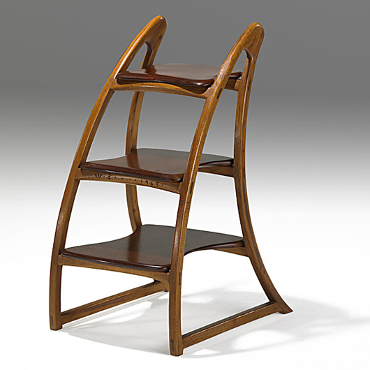 Wharton Esherick carved oak and cherry tiered stand, $45,750. Image courtesy Rago Arts and Auction Center.