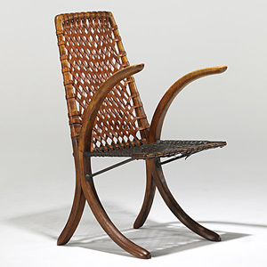 Estimated at $25,000-$35,000, the Wharton Esherick armchair in oak, leather and wrought iron sold for $100,650. Image courtesy Rago Arts and Auction Center.