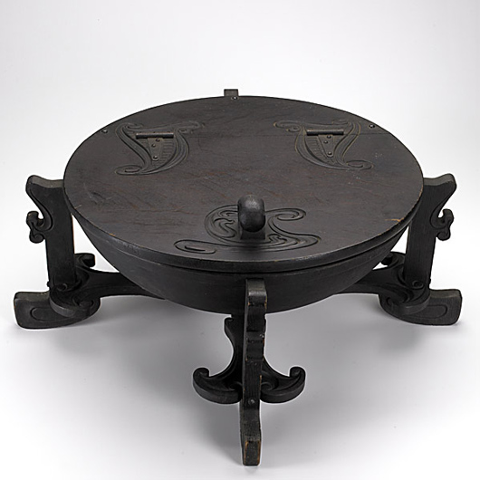 Charles Rohlfs oak coal hod, $41,480. Image courtesy Rago Arts and Auction Center.