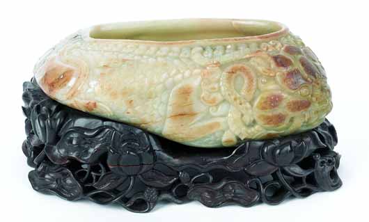 Large Chinese carved jade brush wash, circa 1900, with stand, 5 1/2 inches high, 12 inches wide. Estimate: $12,000-$18,000. Image courtesy Pook & Pook Inc.