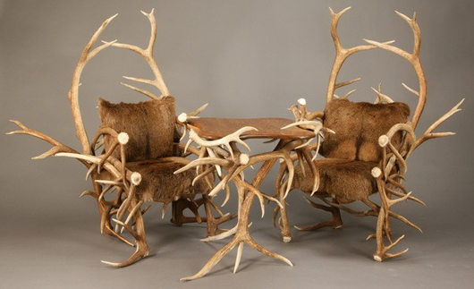 Three-piece grouping of finely crafted of elk antlers, the table with solid oak top, the chairs with cushions of elk fur and suede. Estimate: $5,000-$8,000. Image courtesy of Great Gatsby’s.