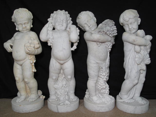 Quartet of life-size Italian marble cherubs representing the four seasons, each 36 inches tall. Estimate $4,000-$6,000. Auctions Neapolitan image.