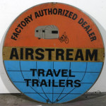 An authorized dealer sign for Airstream travel trailers. Image courtesy of LiveAuctioneers and Kimball M. Sterling Inc., Auctioneer and Appraiser.