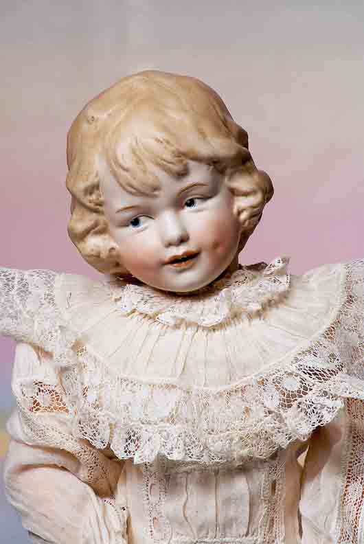 Considered rare, this precious Gebruder Heubach character girl with molded hair stands 16 inches tall. The German beauty, estimated at $8,000-$16,000, has deep and expressive character modeling, fine quality bisque and lovely facial painting. Image courtesy of Frasher’s Doll Auctions.