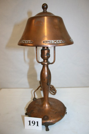 Signed ‘Pairpoint’ lamp base with copper shade, 14 inches high. Image courtesy of Old Barn Auction.