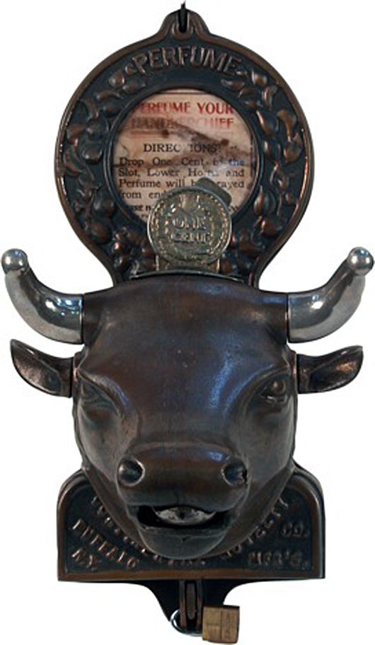The American version of the 1-cent cast-iron wall mount bull's head perfume machine by Continental Novelty Co., Buffalo, N.Y., circa 1908. Turning the bull’s horns sprays perfume from his nostrils. Image courtesy of Victorian Casino Antiques.
