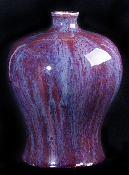 Chinese flambe glazed Meiping vase with bottle neck in purplish crimson glaze with milky blue drips (est. $1,000 to $2,000). Image courtesy of Leland Little Auction & Estate Sales Ltd.